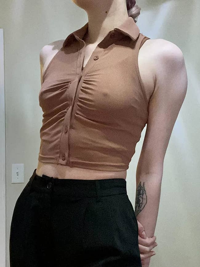 close up of the brown crop top on a reviewer