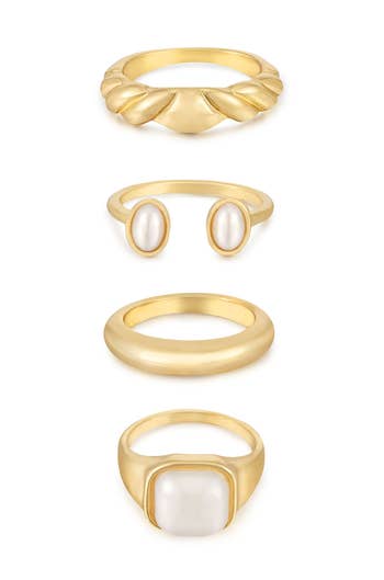four rings: gold twist, gold open band with pearls on either side, plain gold band, and large pearl stone