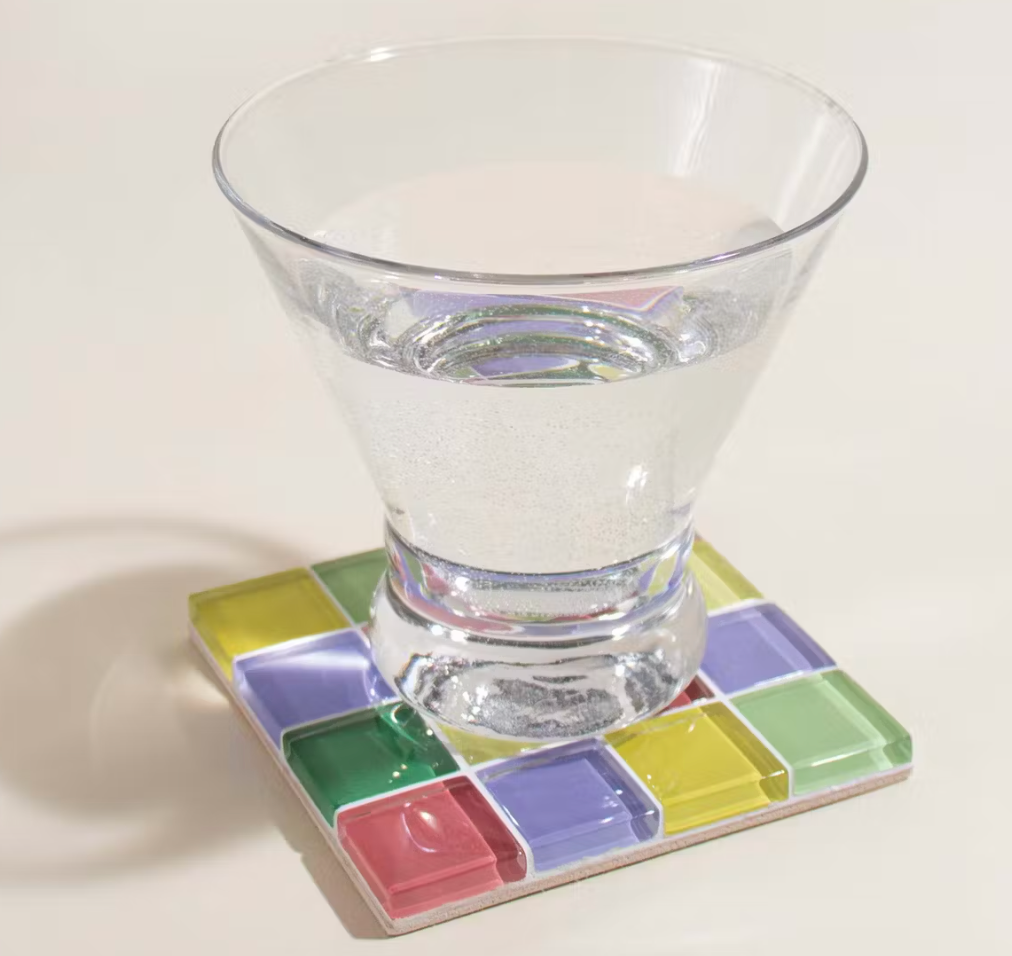 A multi-color tiled glass coaster