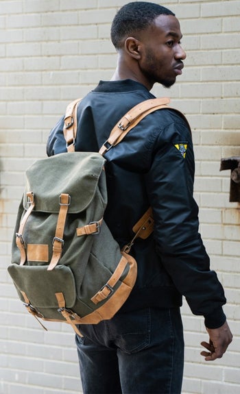 A man wearing the backpack on his back