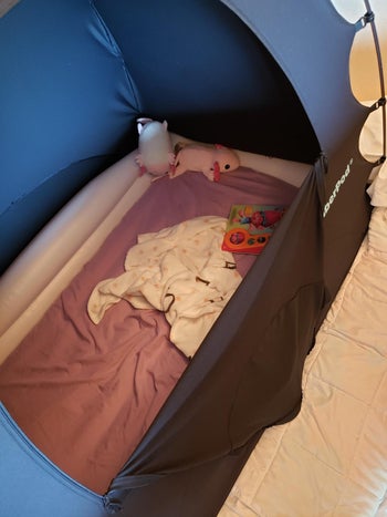 showing inflatable mattress inside tent