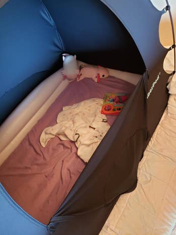 showing inflatable mattress inside tent