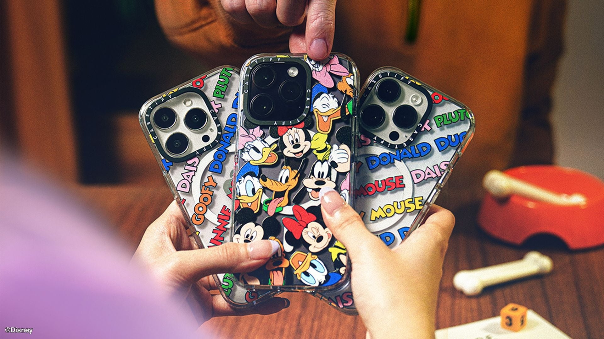 a phone case with mickey & friends on it