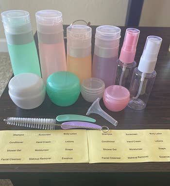 Reviewer photo of all the bottles, jars, scoopers, and labels