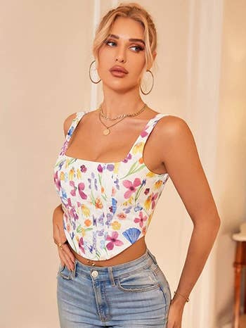 model wearing the white floral corset top