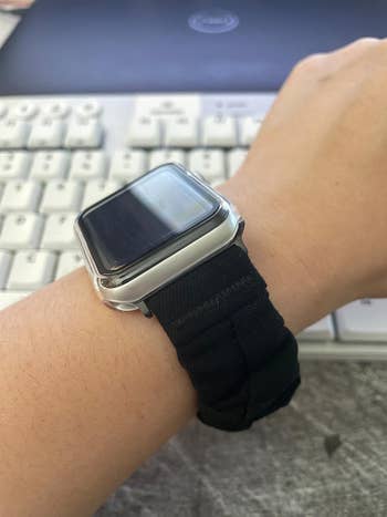 a reviewer showing the side view of the watch band on their wrist