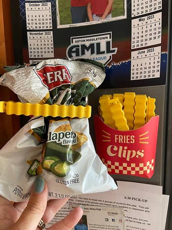 a reviewer using french fry shaped chip clips