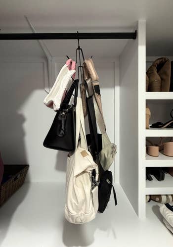 Various handbags hanging connected  a metallic  rod successful  a closet; shelves with shoes and folded apparel  disposable   successful  the background