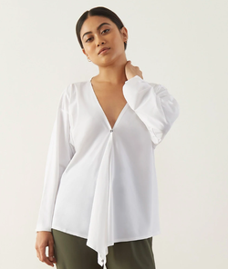 model wearing the white shirt long with it tacked in the middle