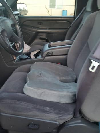 reviewer's car with cushion in seat