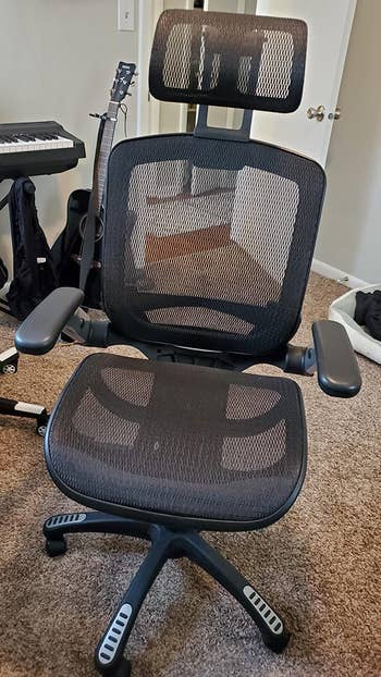 a reviewer's black chair from the front