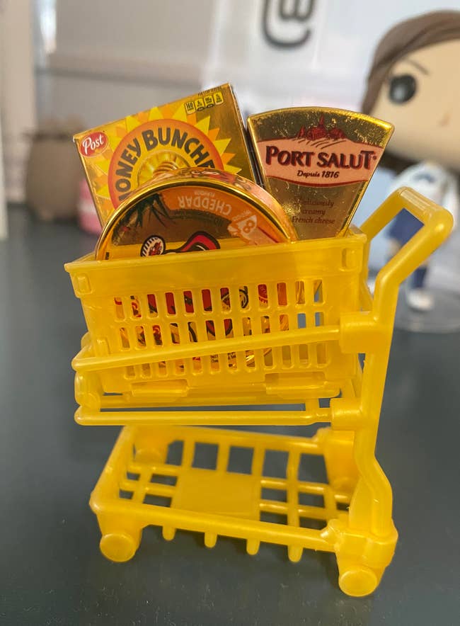 my assembled shopping cart with honey bunches of oats, cheese wedge, and babybel minis