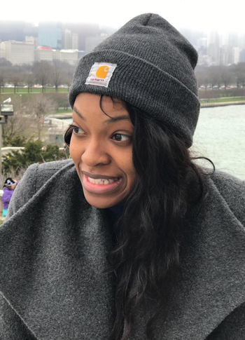 Reviewer in a gray foldover beanie with the Carhartt logo stitched in front