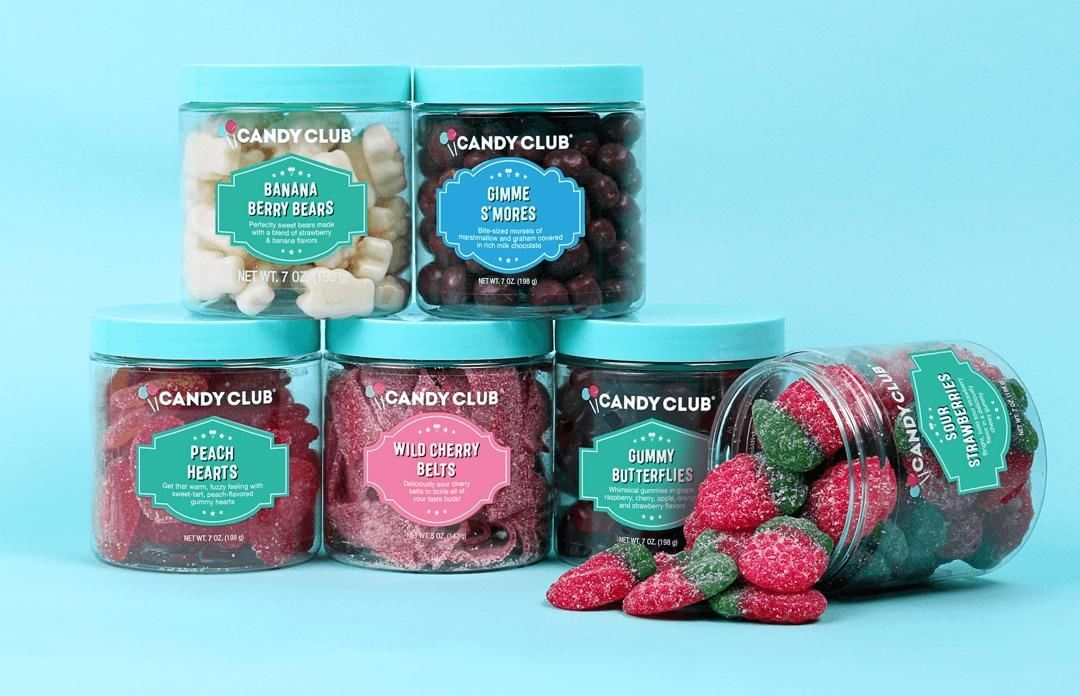 six cups of candy from candy club - sour strawberries, gummy butterflies, wild cherry belts, gimme s'mores, banana berry bears, peach hearts, and wild cherry belts