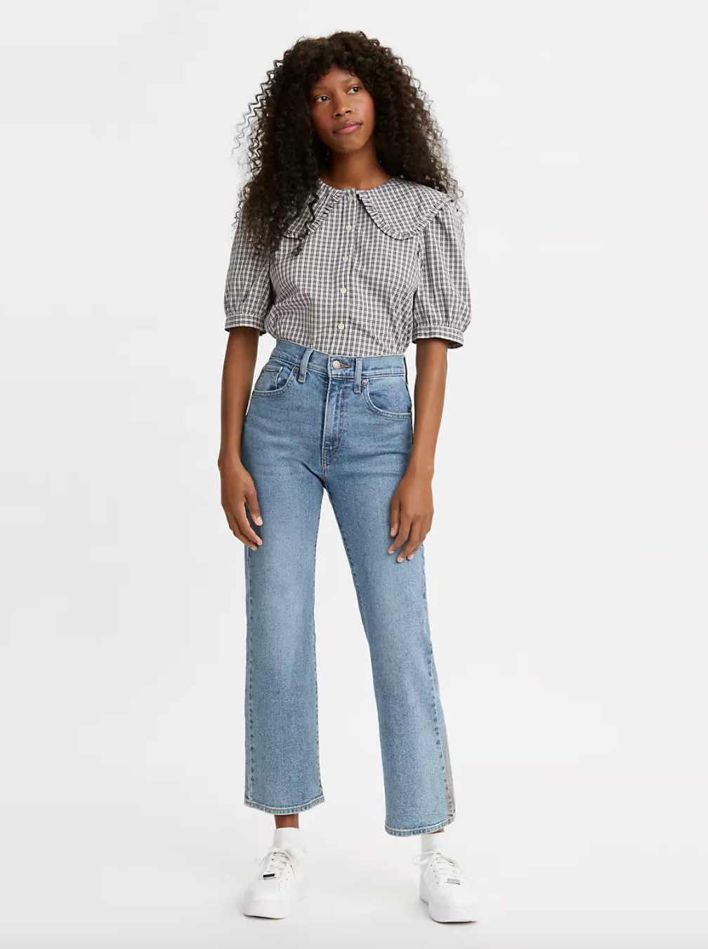 model wearing light wash crop flare jeans