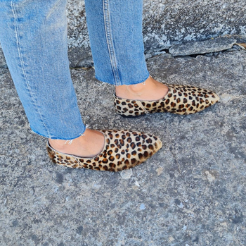 model wearing the leopard print flats