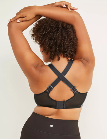 back of a model in an x-back sports bra