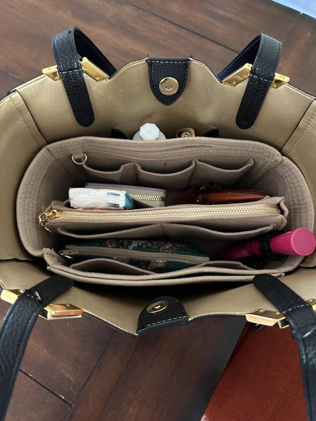 Open handbag with organizer inside