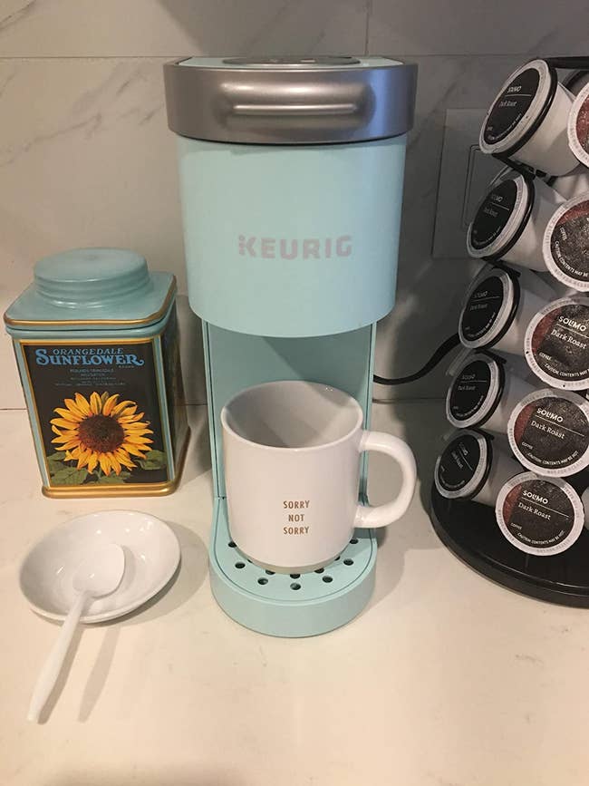 reviewer image of the oasis colored single serve keurig machine on a kitchen counter
