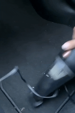 gif of another reviewer using black vacuum on car mat