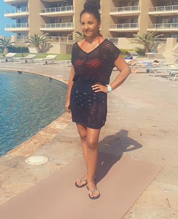 Reviewer wearing black coverup