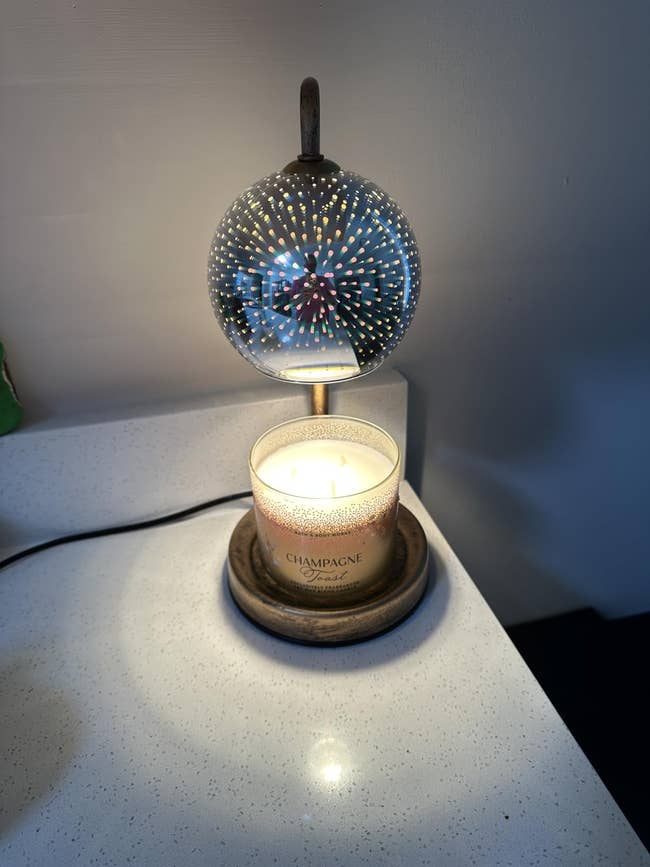 Decorative lamp with a spherical patterned shadiness illuminates a lit