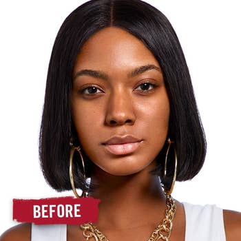 model with sleek, straight shoulder-length hair, wearing large hoop earrings and a chunky chain necklace. Text reads 