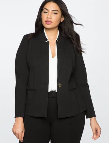 model in black one button blazer with flat lapel