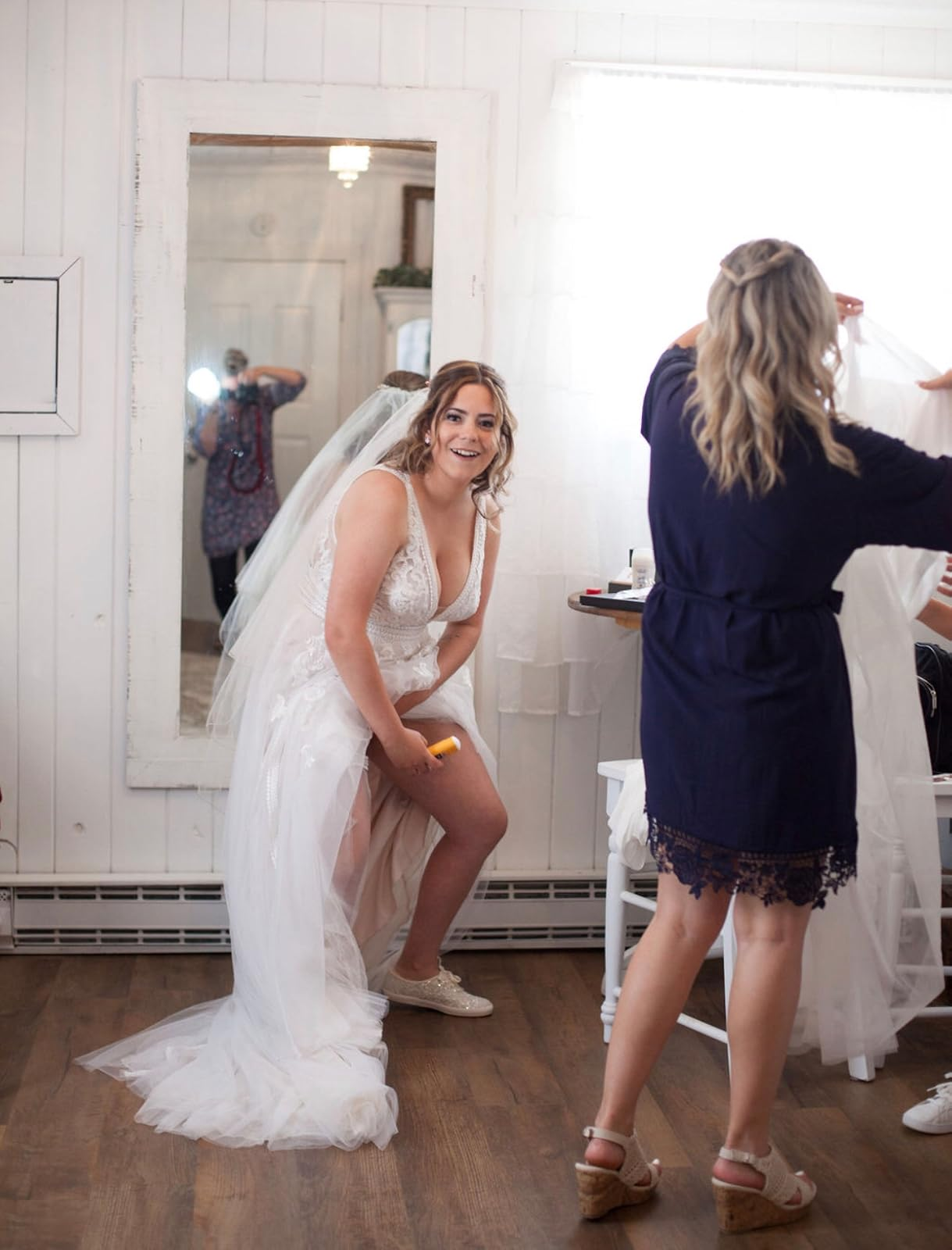 Reviewer in wedding dress applying Gold Bond Friction Defense to their inner thighs