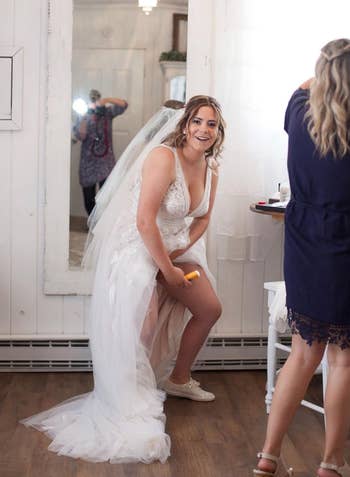 Reviewer in wedding dress applying Gold Bond Friction Defense to their inner thighs