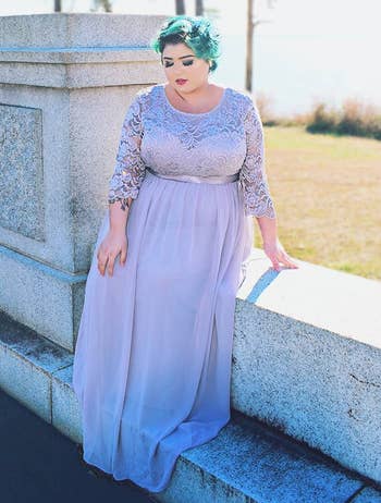 Image of reviewer wearing lilac dress