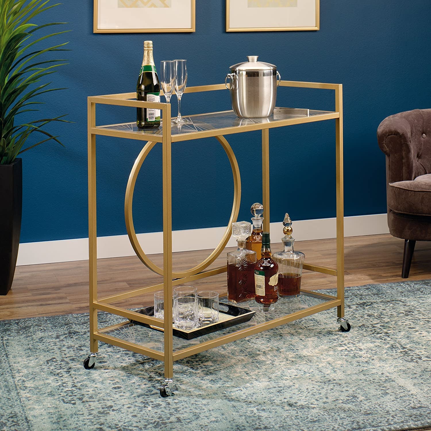 the bar cart with two glass-top shelves with a geometric pattern to them  