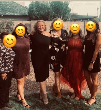 reviewer in group photo wearing the dress in black