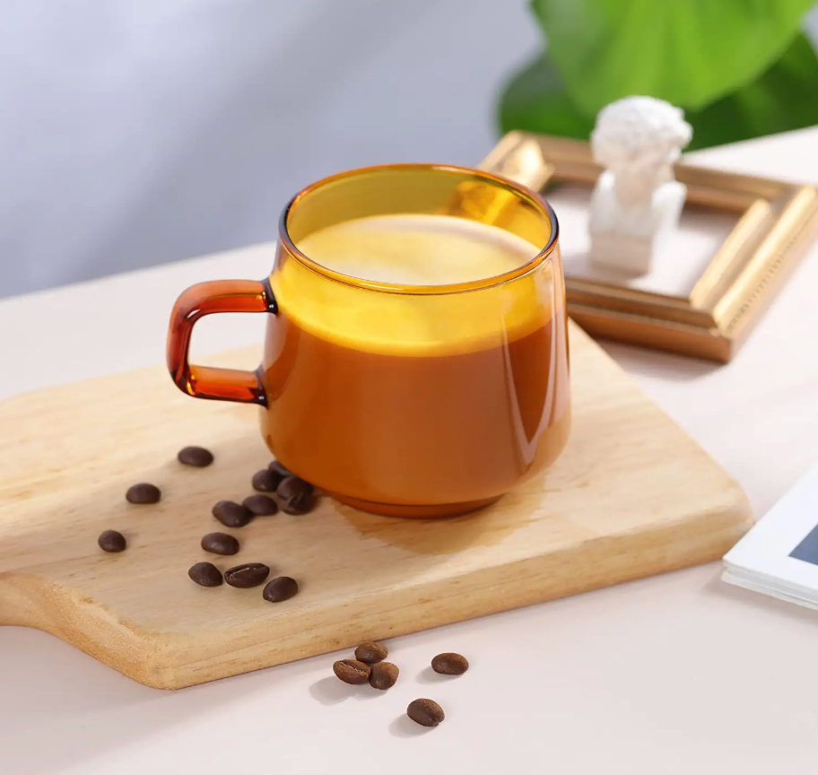 the amber mug holding coffee