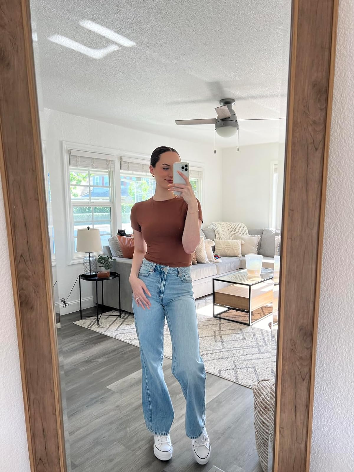 reviewer wearing brown top