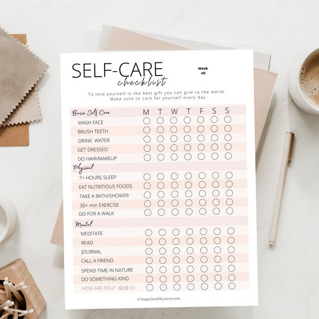 A pink and white self-care checklist with sections for basic self care, physical care and mental care, plus bubbles to fill in for each day of the week 