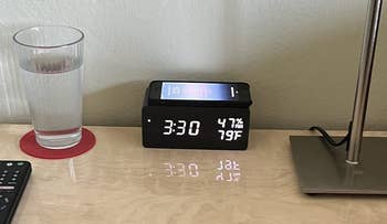 the alarm clock charging a phone