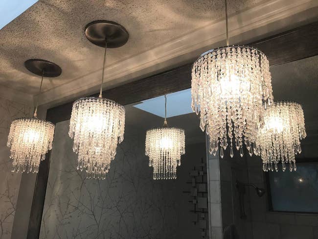 three chandeliers hanging from the ceiling