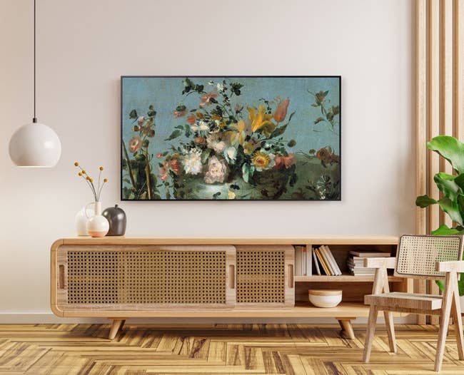 a samsung frame TV displaying a vintage oil painting of flowers