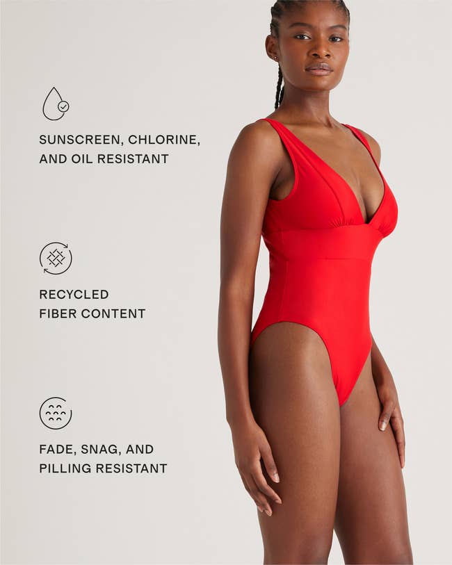 Model in red one-piece swimsuit showcasing sustainable fabric benefits