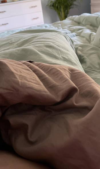 brown sheets on a bed 