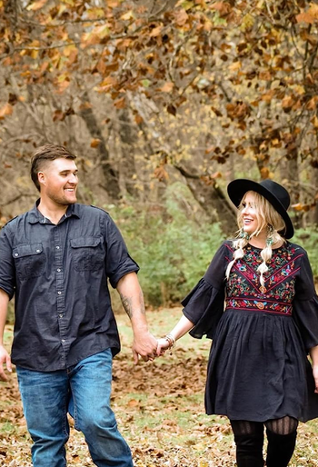 reviewer in the black baby doll dress