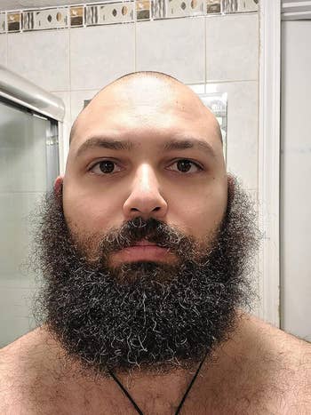 a reviewer's beard before using the straightener all curly