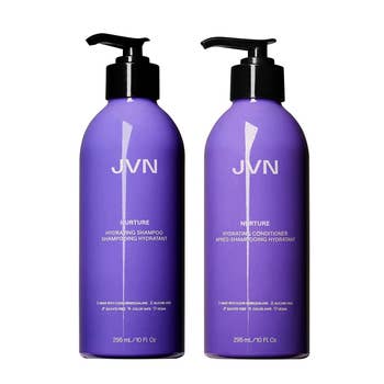 Purple shampoo and conditioner bottles with black pumps on a white background