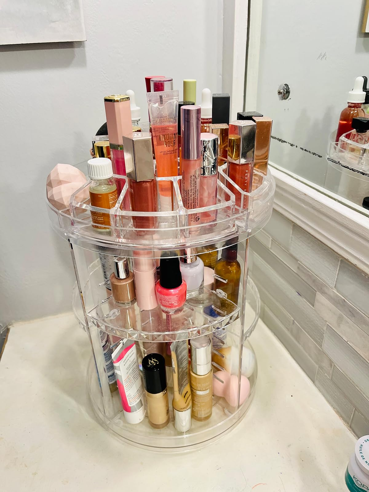 another reviewer's wide   rotating organizer with assorted  products connected  it
