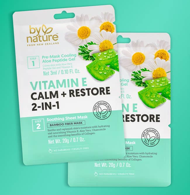 Two packages of By Nature Vitamin E Calm & Restore 2-in-1 look masks, featuring soothing gel and fibre mask, each 7 inches tall