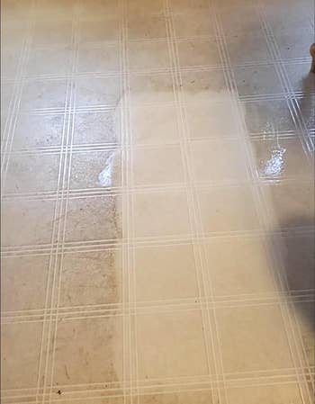 a reviewer's tile floor while being cleaned by the magic eraser