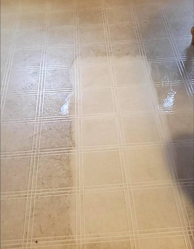 a reviewer's tile floor while being cleaned by the eraser sponge