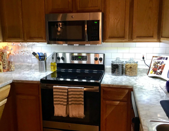 small kitchen with lights under the cabinet for a larger, brighter look
