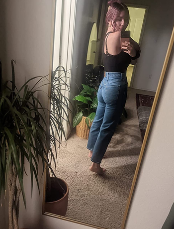 same reviewer showing jeans from the back